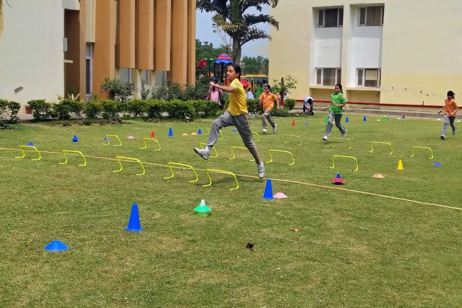 Indian school students participating in athletics and movement activities