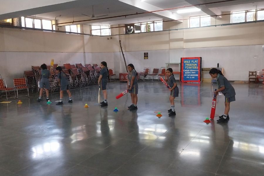 Indian school children practising cricket skills