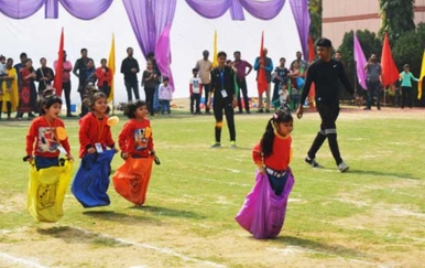 Students running in a school athletics activity